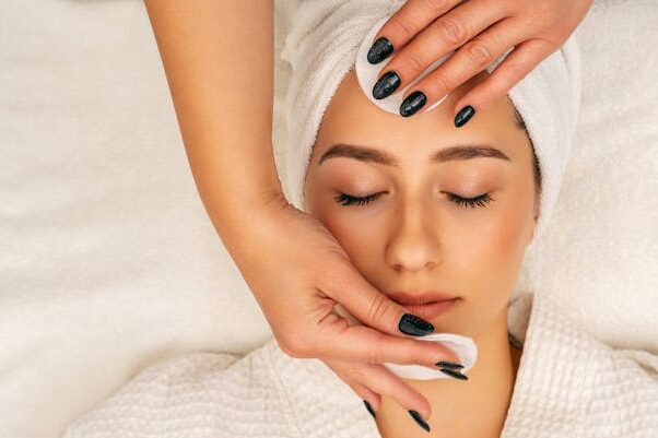 pexels-photo-14256897-14256897 A woman receiving a soothing facial massage at Zen spa for relaxation and skincare.